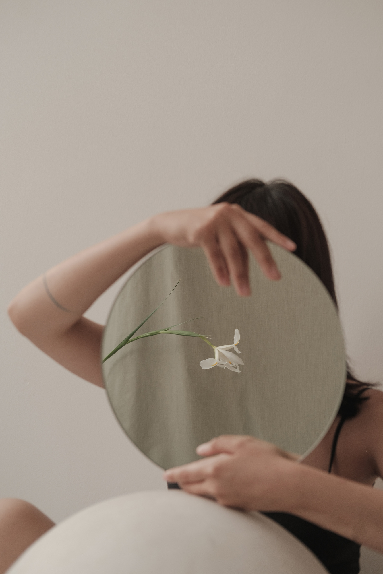 Woman Holding Round Mirror